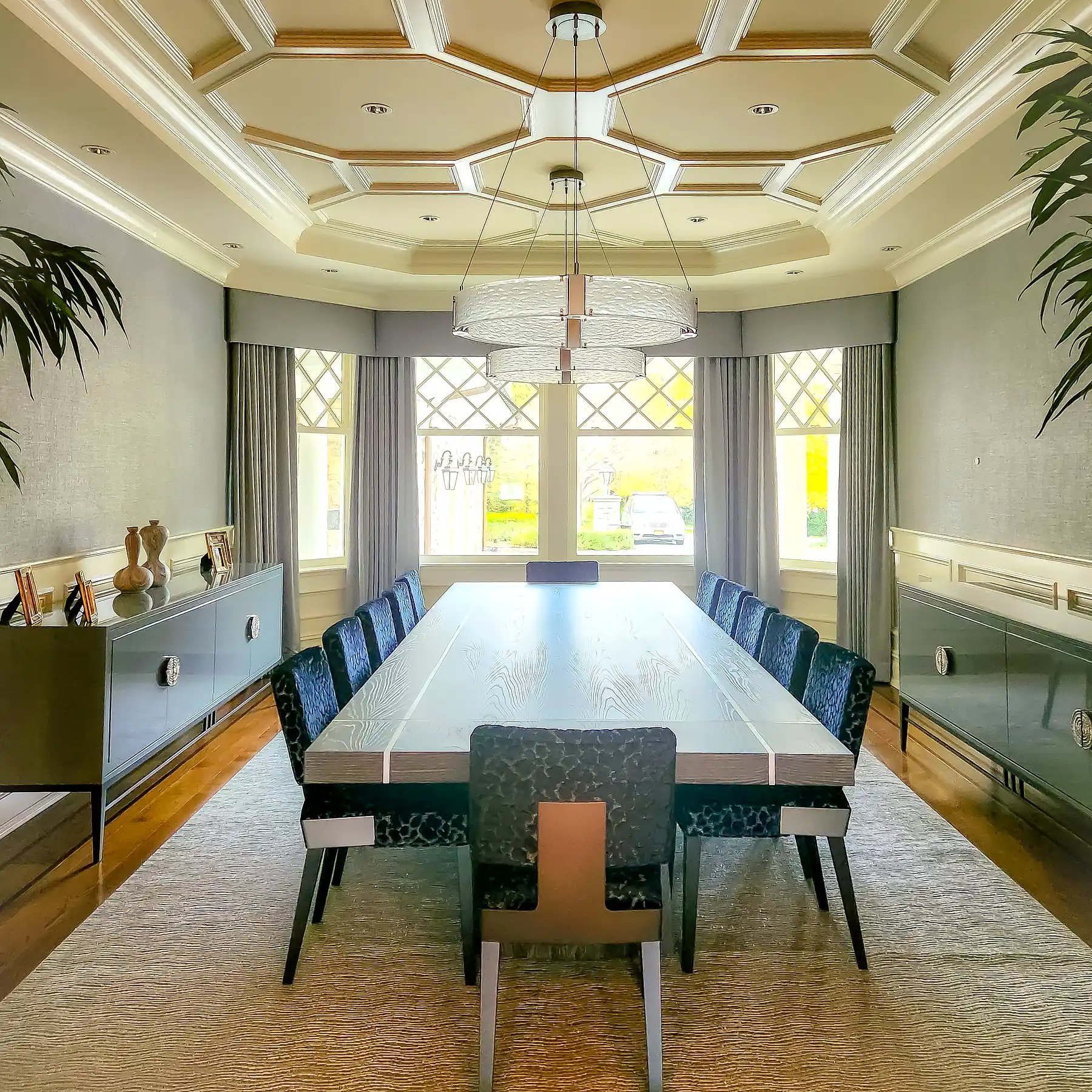 Ripplefold drapery across three bay windows in a dining room with coffered ceiling